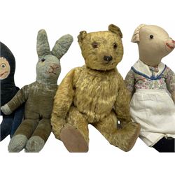 1950's teddy bear with jointed limbs, revolving head, wood filled body, stitched nose and mouth, applied glass eyes and foot pads, together with a quantity of handmade soft toy rabbits and penguins. 