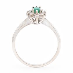 18ct white gold emerald and diamond cluster ring, single marquise cut emerald 0.25 carat, surrounded by twelve round brilliant cut diamonds, London 1979, total diamond weight approx 0.25 carat