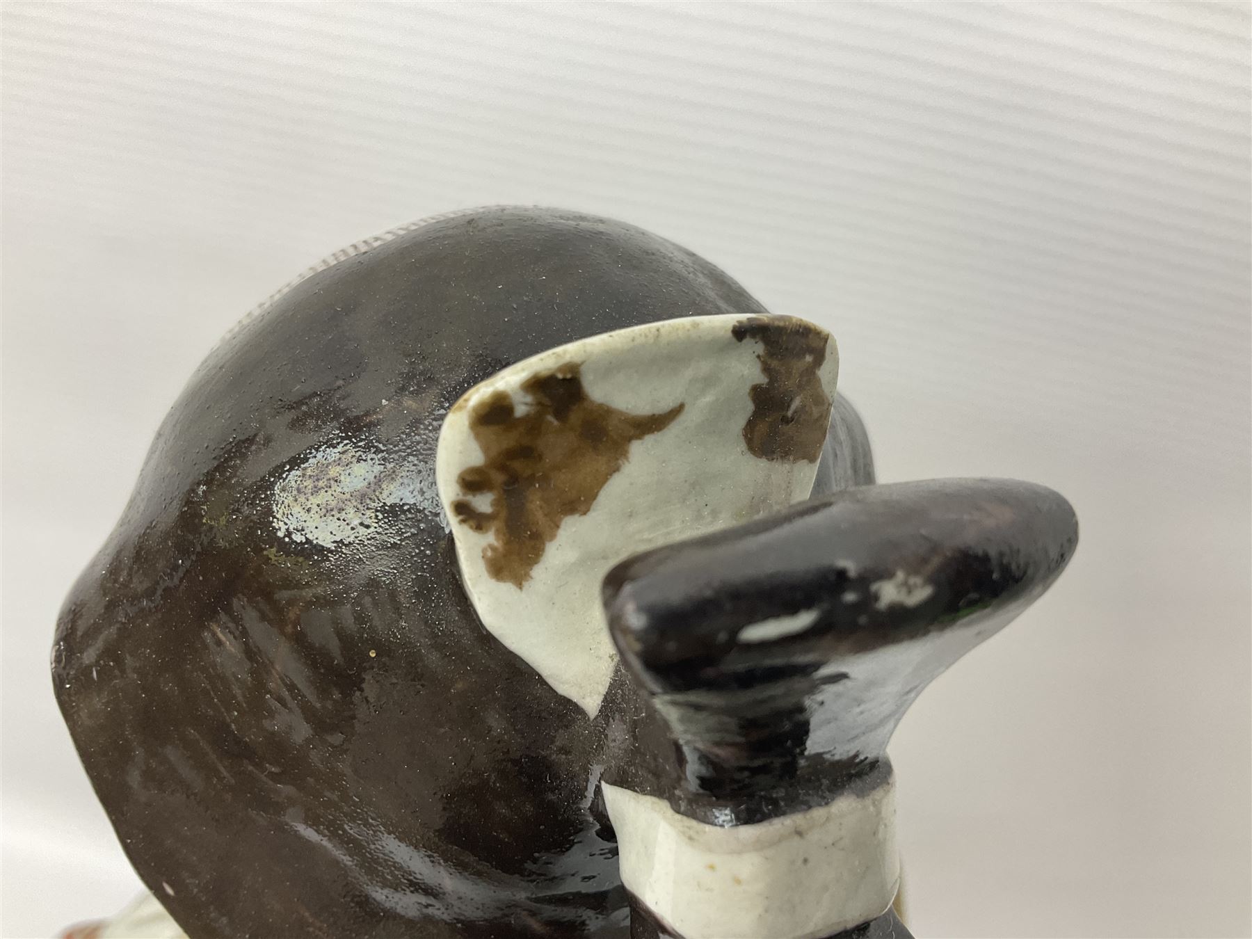 Large Japanese Imari porcelain figure, modelled as a Bijin, wearing a long kimono decorated with apple blossom and leafy branches on a white ground, with gilt detailing, possibly Edo period, H63cm