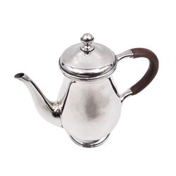 Liberty & Co 1930s small silver coffee pot, of plain baluster form, with brown Bakelite C handle with trefid mounts and cover with spherical knopped finial, upon circular stepped foot, hallmarked Liberty & Co, Birmingham 1934