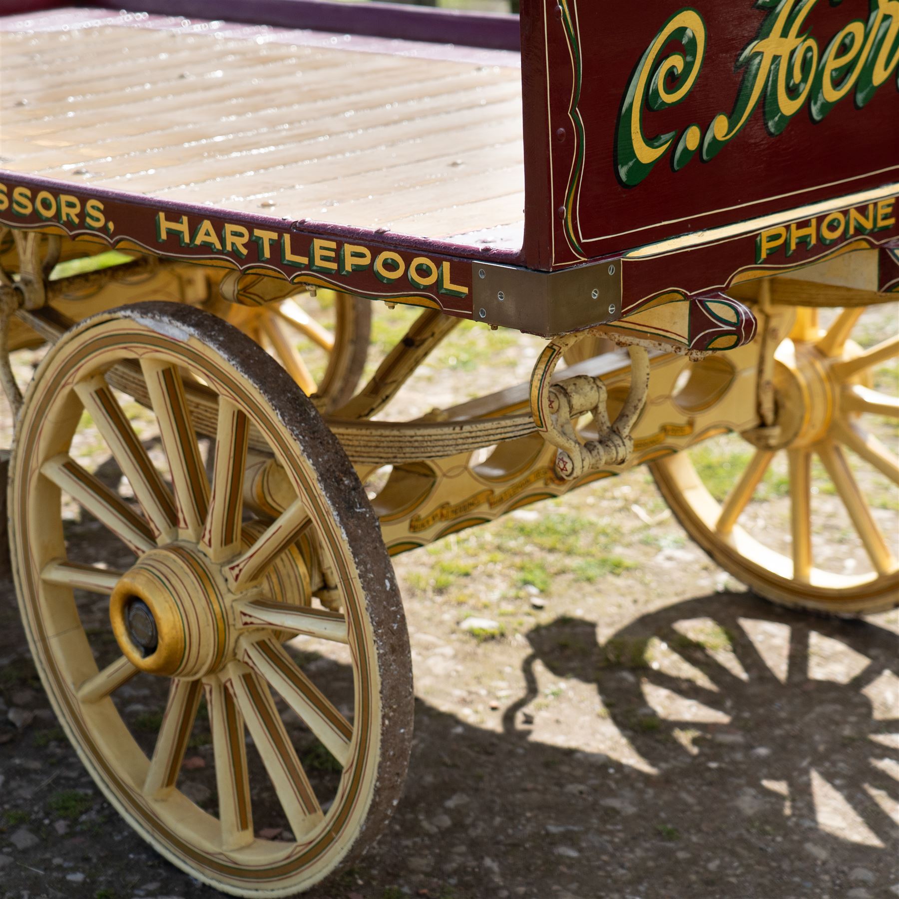 Advertising Trade Dray Wagon for C. Herring & Son, Hartlepool, Dated 1895 and Renovated 1975

An exceptionally decorative late Victorian horse drawn advertising trade dray, built by J. Herring of Hartlepool in 1895 and later renovated by C. Herring in 1975, as recorded by the painted inscription beneath the body. Finished in a striking cream and maroon livery with extensive hand painted signwriting, the wagon carries the name C. Herring & Son, Iron & Steel Processors, Hartlepool along its sides and rear panels. The wagon is fitted with a flat timber loading bed, twin shafts for a single horse, elegant spoked wooden wheels, iron bound tyres, rear headboard and traditional undercarriage with leaf spring suspension. Richly detailed scrollwork and lining throughout make this a particularly attractive example, suitable for collection, display, museum, promotional or coaching purposes.

Features

• Built by J. Herring, Hartlepool, 1895
• Renovated by C. Herring in 1975
• Original style hand painted advertising signwriting
• Flat timber loading platform
• Raised rear headboard with decorative pierced gallery
• Twin shafts for a single horse
• Wooden spoked wheels with iron tyres
• Traditional leaf spring suspension
• Extensive decorative lining and scrollwork throughout
• Attractive cream and maroon colour scheme
• Suitable for private collection, museum or display use

Dimensions:
Overall length: 560 cm
Body length: 300 cm
Width: 158 cm
Height: 150 cm

Wheel Diameters:
Front wheels: 76 cm
Rear wheels: 86 cm
