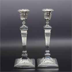 Pair of Georgian design plated candlesticks on square bases H26cm, plated hot water dish, the cover with deer lift and a plated two handled tureen with associated cover