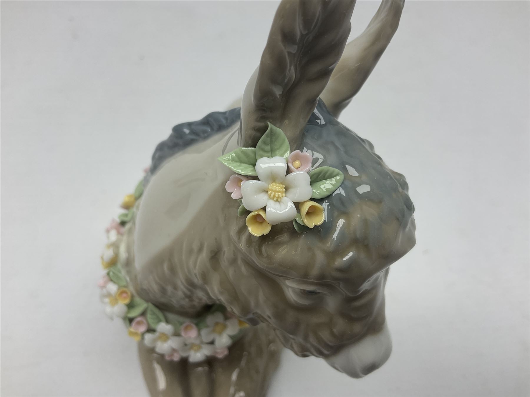 Lladro figures of animals, comprising Mini Lion no 5436, Beautiful Burro no 5683, Hawk Owl no 5422, Beagle Puppy Sitting no 1071, Duck Flying no 1264, Miniature Cat no 5308 and Small Papillon Dog no 4749, four with original boxes, largest example H14cm