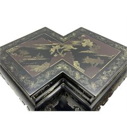 Chinese black lacquer double jardinière stand, the double-lozenge top painted with traditional landscape scenes within a gilt strung border, the pierced frieze with trailing foliate decoration and geometric patterns over the shaped projecting apron, supported on six cabriole supports united by a hexagonal undertier, raised on compressed spade feet