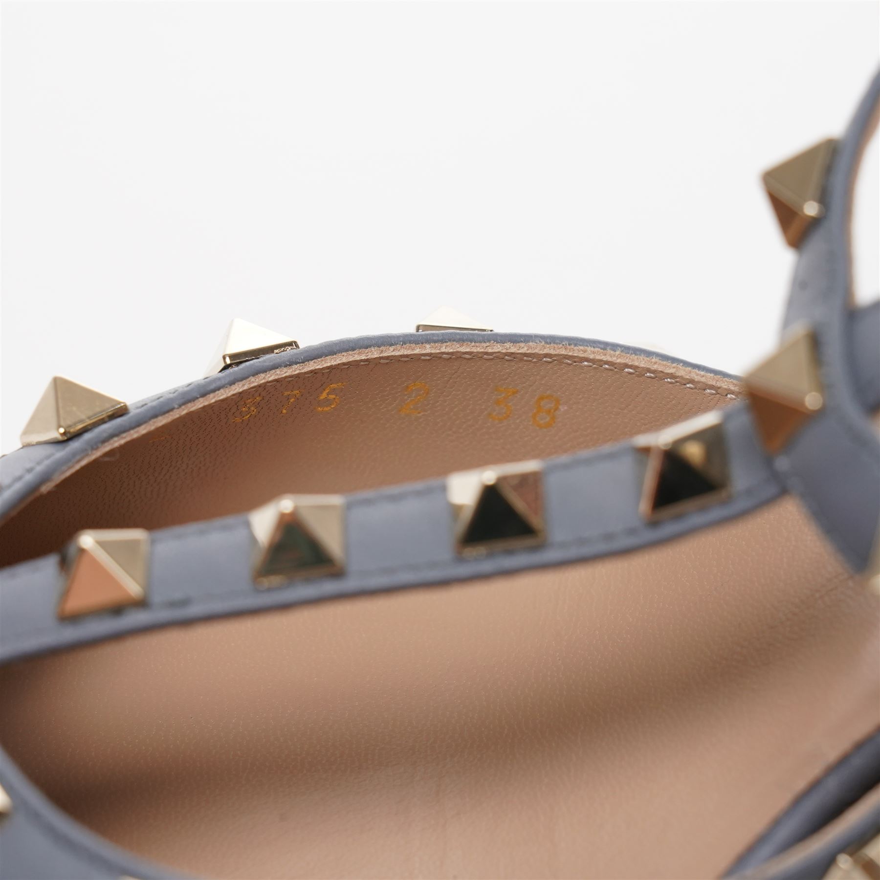 Valentino Garavani - pair of Rockstud grained leather and leather strap stiletto heels in blue, with pointed toes and gold tone pyramid stud detailing to the uppers, size 38, unused with original box and dust bag