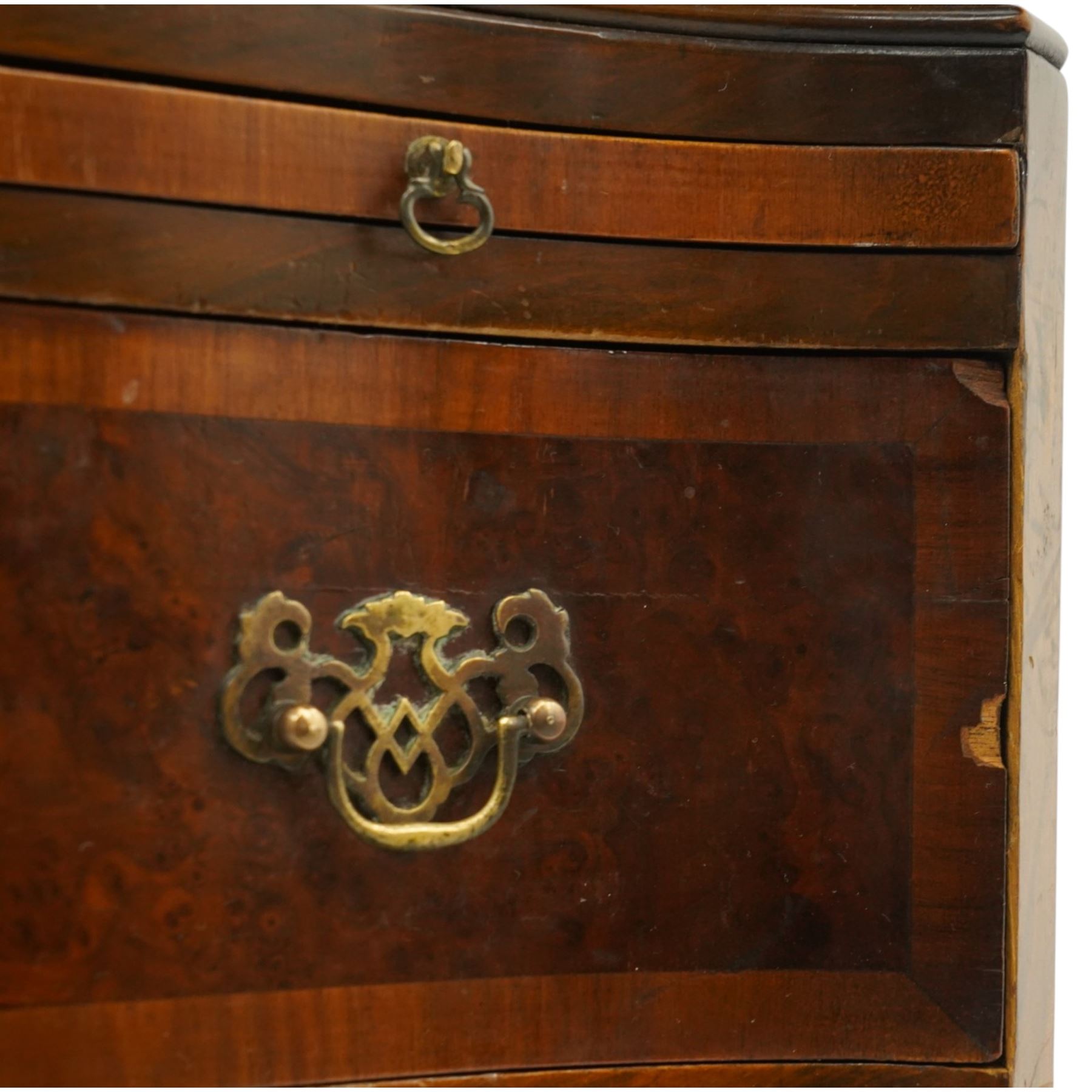 Queen Anne style burr walnut serpentine chest on chest, the upper chest with four graduating drawers with burr fronts and cross banded edges and pierced brass handles, the bottom chest with brushing slide above three graduated drawers, shaped lower apron on splayed feet 