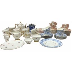 Collection of tea wares including set of four cups and saucers and six side plates decorated with blue transfer printed foliate decoration with gilt edging, set of six cups and saucers and side plates decorated with red transfer printed foliate and a set of Lubern 22kt gold tea wares. 