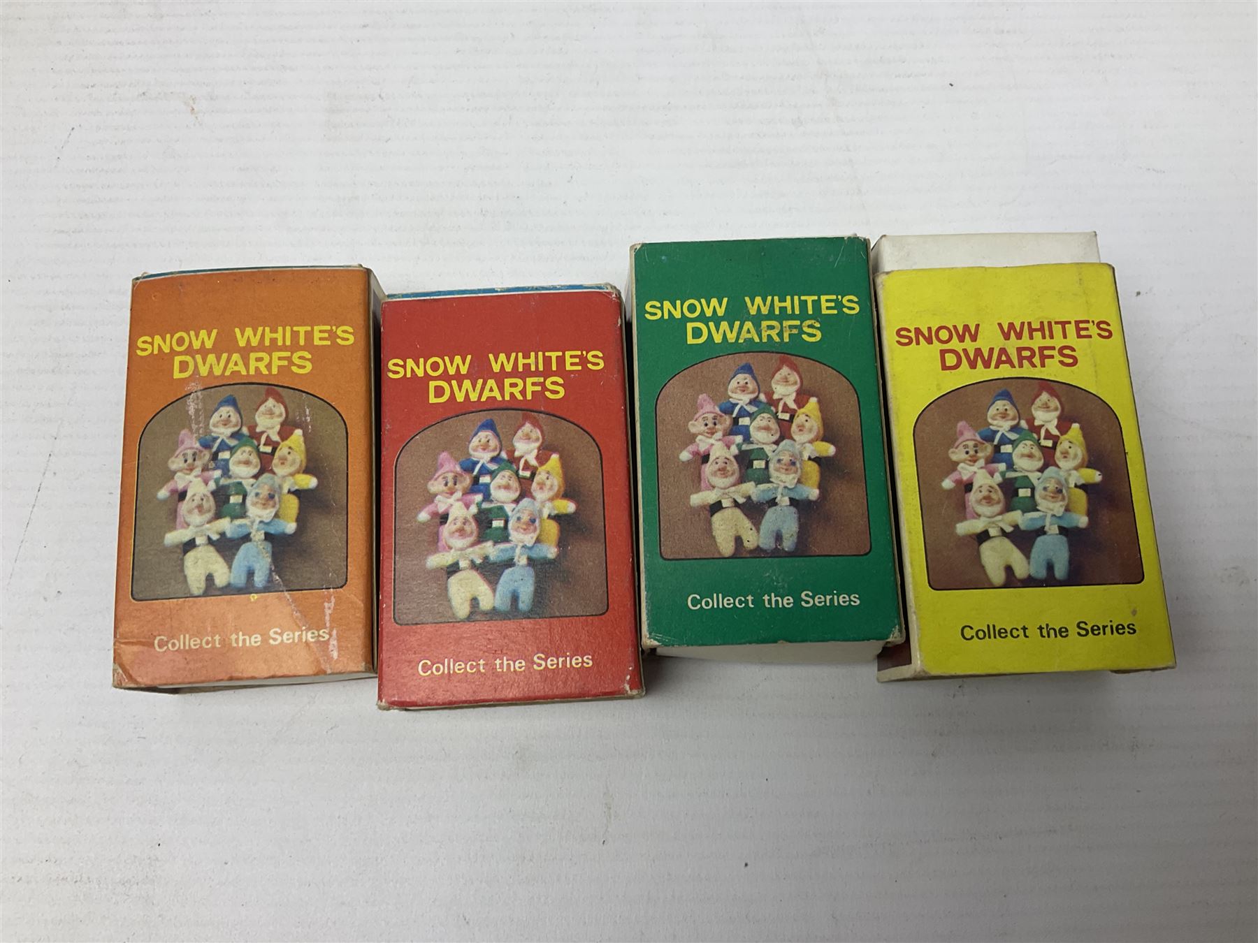 Twenty-six 1970s miniature Beanie matchbox dolls - Donald Duck with Huey, Dewey and Louie; seven dwarfs from Snow White (plus additional Happy); three Rescue Squad; two Cutie Fruitie; four animals; two Black/White series; Micetto; Orsetto Panda; and Uncle Scrooge; all boxed (26)