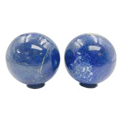 Pair of Lapis lazuli spheres, upon a carved stone stands, D8cm
