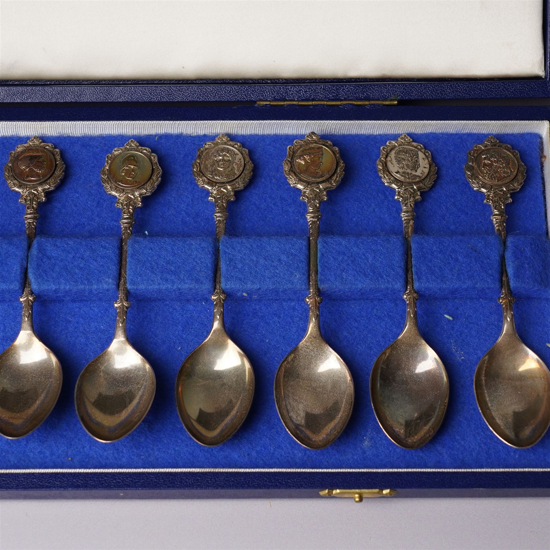 'The Twelve Roman Spoons' a set of twelve silver spoons each with the head of a Deity in fitted case London 1971 Maker John Pinches