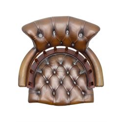 Mahogany framed swivel Captains desk chair, upholstered in brown buttoned leather, turned supports and swivel base on castors