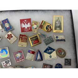 Over one hundred Soviet space programme badges; in two glass topped display boxes (2)