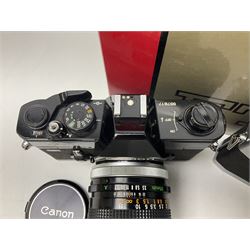 Canon FTb camera body, serial no. 715838, with 'Canon FD 50mm 1:1.8' lens, serial no. 207888, in original box, together with Canon FTb camera body, serial no. 557817, with 'Canon FD 35mm 1:3.5 S.C' lens, serial no. 126210 and Canon EX Auto camera body, serial no. 296244 with 'Canon EX 50mm 1:1.8' lens, serial no. 380869  