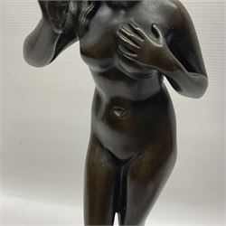 Bronze nude female figure holding a rose, upon a stone plinth, H40cm 