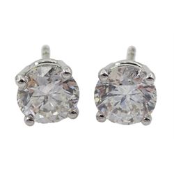 Pair of 18ct white gold single stone round brilliant cut diamond stud earrings, total diamond weight 1.97 carat, with certificate