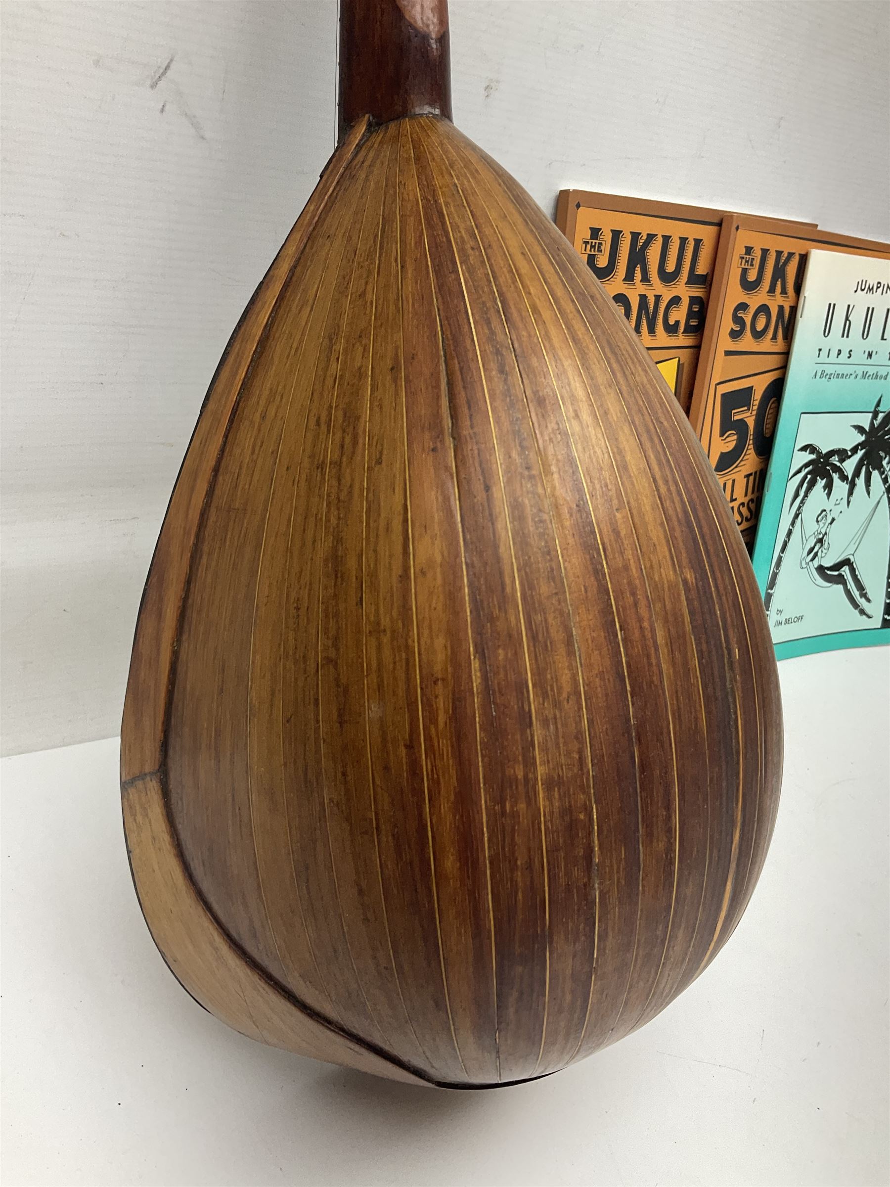 W.D. Keech banjolele pat.219720/23 with etched signature to the back; serial no.A12082 L55cm; and a restored Italian mandolin with segmented lute back; together with three music books