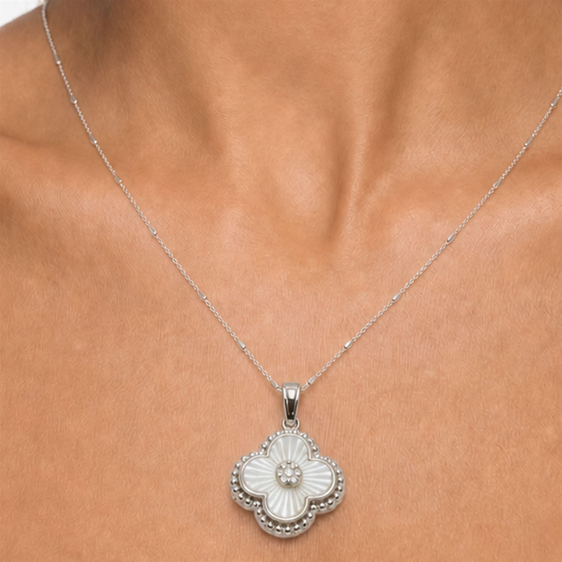 Silver cubic zirconia and mother of pearl flower head pendant necklace, stamped 925