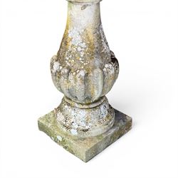 Large weathered cast stone sundial, raised on circular column of bulbous form, square plinth base