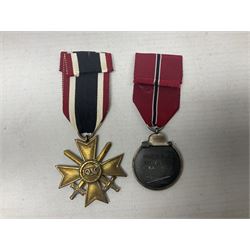 Two WW2 German medals - Winter Campaign in Russia 1941-42 and War merit Cross with swords; both with ribbons (2)