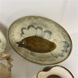 Collection of Yorkshire Moorlands Pottery, comprising two large circular dishes and three jugs, decorated with various fish, flowers, red grouse and cockerel