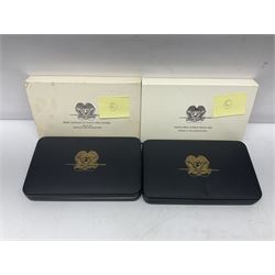Four Papua New Guinea proof eight coin sets, from ten kina to one toea, comprising First Coinage of Papua New Guinea 1975 proof set, 1976, 1977, and 1979 proof sets, the 1977 and 1979 sets containing 925 silver ten kina and 500 silver five kina coins, all minted at the Franklin Mint, cased with certificates (4)