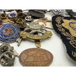 Collection of military and similar enamel badges, pin badges, cloth badges and brasses