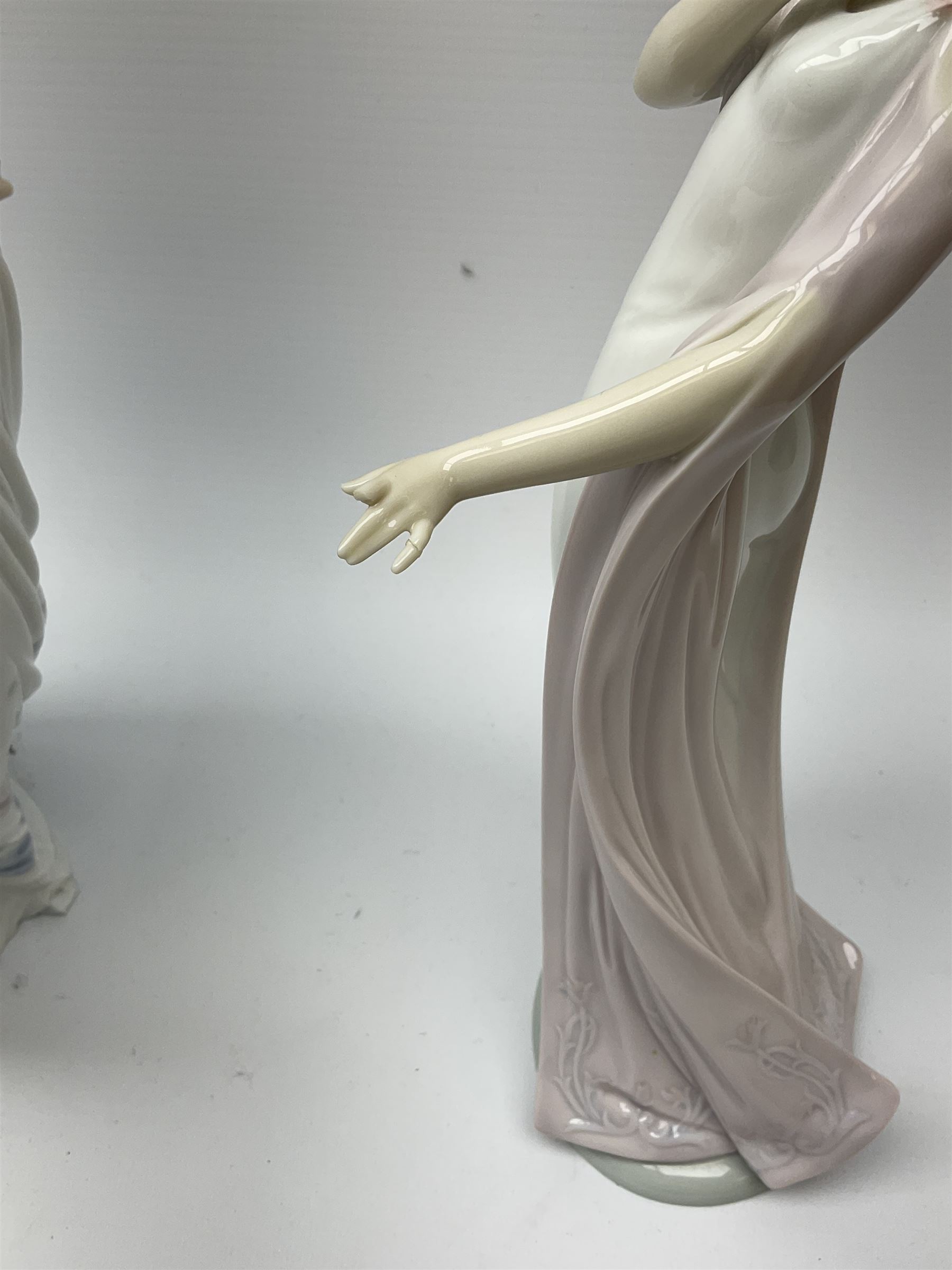 Large Lladro Figures, Spring Splendor, designed by Regino Torrijos, model number 5898, H30.5cm, the glass slipper, designed by Jose Puche, model number 5957, H29cm and Breathless, designed by Juan Ignacio Aliena, model number 6430, H31cm.