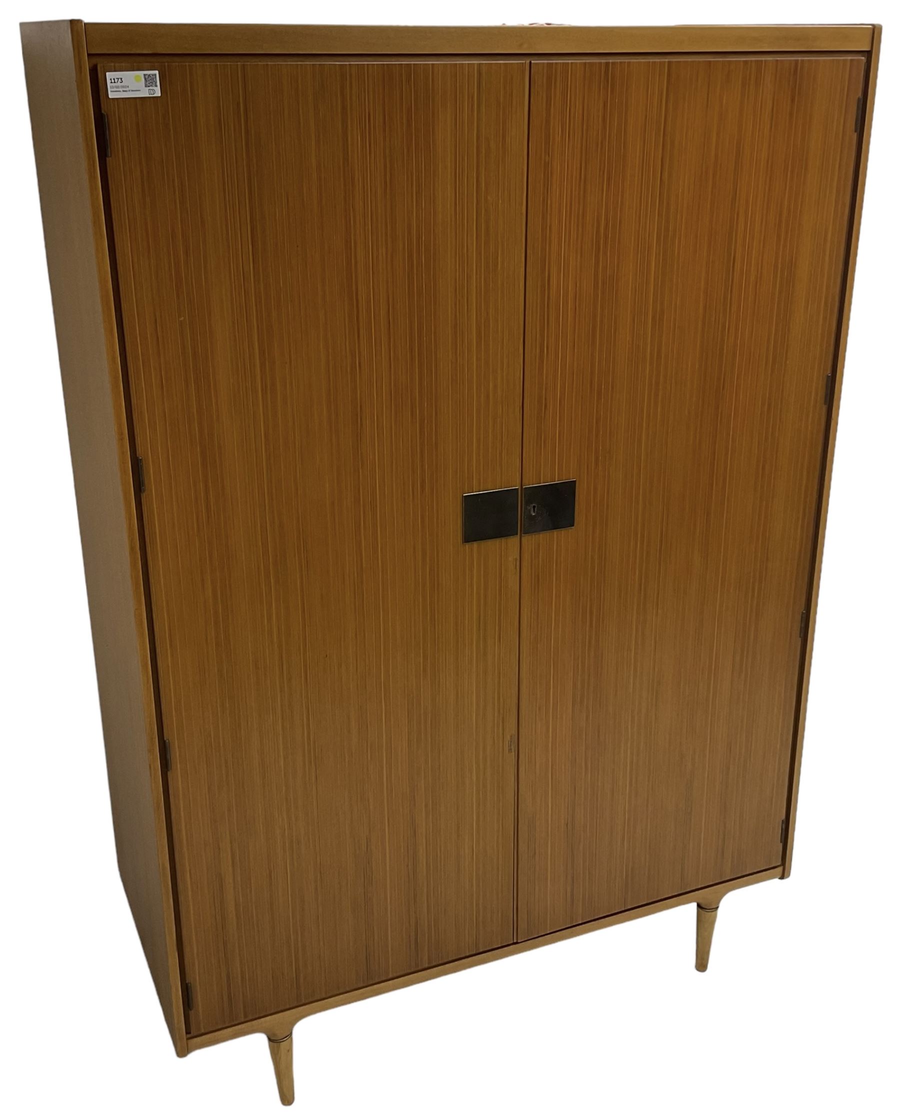 Wrighton - mid-20th century teak wardrobe, two doors enclosing hanging rail, shelves and hinged compartments, on turned tapering feet
