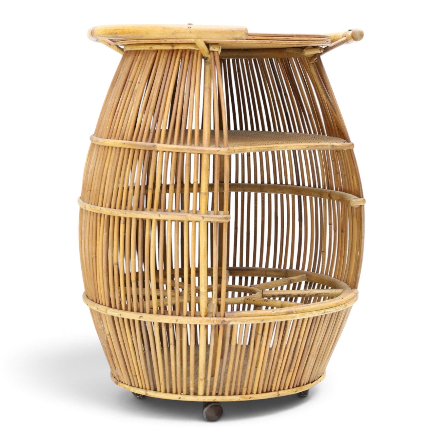 Italian mid-20th century barrel-shaped bar cart in rattan and bamboo, the circular top with rattan and bamboo handle, above a rattan shelf with bamboo bottle dividers below, raised on castors