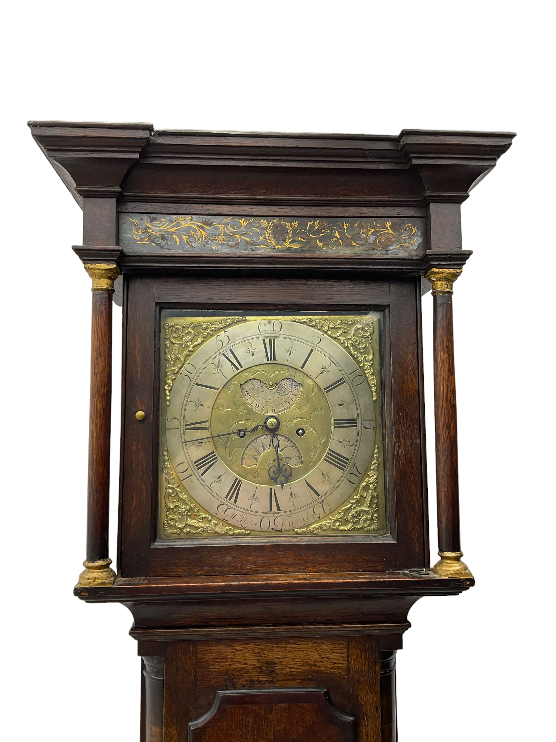 William Lister (II) of Keighley – 8-day 18th century oak cased longcase clock c1760, hood with a break front flat topped pediment and eglomise  frieze beneath, square hood door flanked by matching pilasters with gesso capitals, trunk with quarter columns and long trunk door with a flat top and convex shoulders, square plinth with a decorative skirting, 12” brass dial with rococo spandrels, engraved dial center, silvered chapter with Roman numerals, five minute Arabic’s, half hour markers and minute track, semi-circular apertures with engraved calendar and moon phase/lunar age discs, original blue steel fretted hands, four pillar rack striking movement with a recoil anchor escapement, striking the hours on a bell. With pendulum, weights and key.
The Lister family were a prolific family of clockmakers working in the West Riding of Yorkshire during the 18th century. Working in various locations including Halifax, Keighley and Luddenden.
William Lister (I) is recorded as working in Keighley from 1715-37 and his son William (II) from 1735-1785.
