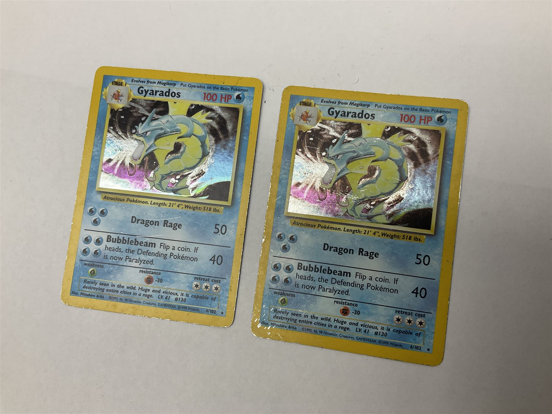 Collection of Pokemon trading cards, mostly 1999 Wizards Pokemon cards to include holo Charizard 4/102, first edition holo Machamp 8/102, further holographic cards; Dark Flareon 35/82 and Dark Vaporeon 45/82, cards from themed sets and 4th edition prints; 1998 Electronic Pokédex with cardboard boxes for themed decks Blackout, Overgrowth and Power Reserve Jungle, along with a large quantity of energy and trainer cards 