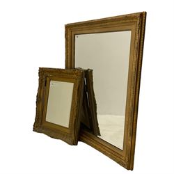 Bevelled mirror in swept gilt frame (79cm x 97cm), and a similar smaller mirror (62cm x 51cm)