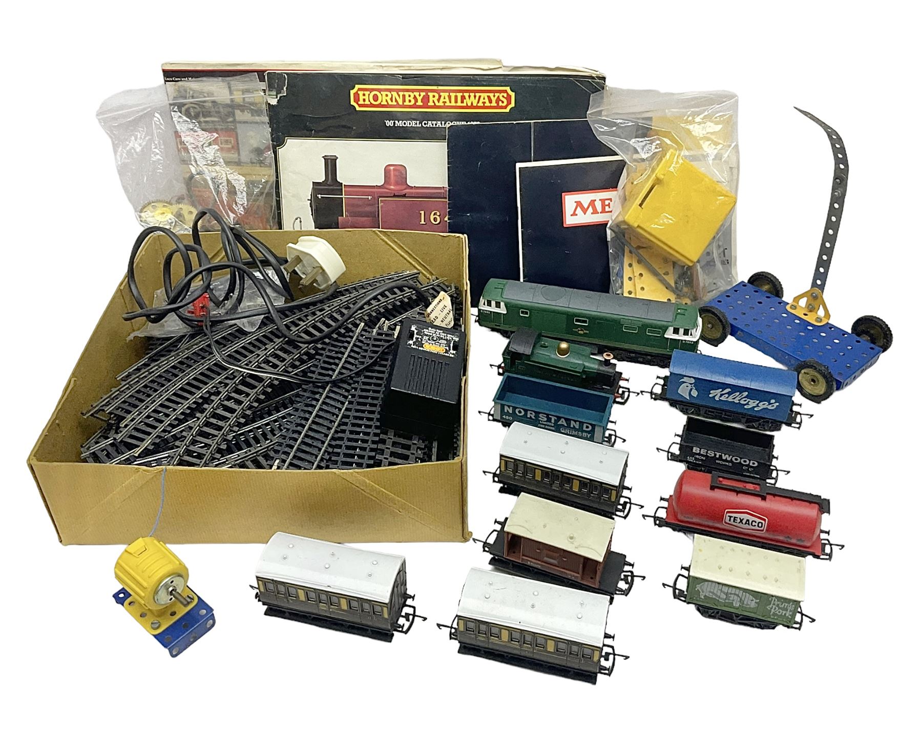 Hornby '00' gauge - Class 35 Hymek Diesel Hydraulic B-B locomotive No.D7063; Class 101 Holden Tank 0-4-0 locomotive No.101; nine wagons/coaches; track and controller; and 1978 catalogue; together with small quantity of loose Meccano with two booklets; all unboxed