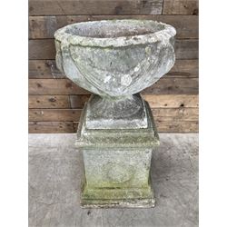 Cast stone centerpiece urn on plinth