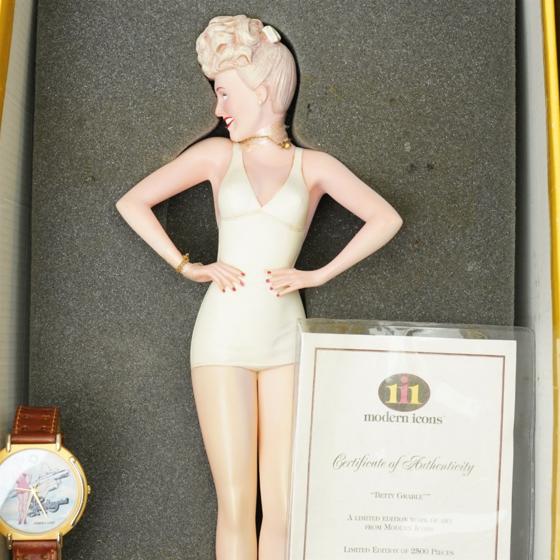 Betty Grable -  A purse designed as a bunch of violets and used by Betty Grable in the film 'Sweet Rosie O'Grady' 1943 and won in a competition in the Sunday Pictorial newspaper by Beth Jackson with newspaper cuttings, letter, photographs etc, together with a limited edition figure of Betty Grable by Modern Icons 458/2500, with magazines, books and other items relating to Betty Gable