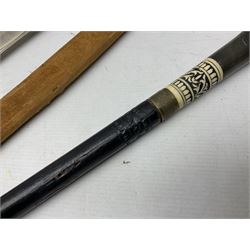 Early 20th century Indian ebonised sword stick, the 59.5cm blade with punched decoration and horn grip L94cm overall; and a reproduction Indian tulwar with scabbard (2)