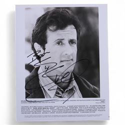 Four Sylvester Stallone film stills and promotional shots, including one depicting Rocky Balboa in the ring, three signed by Sylvester Stallone and one signed by Brigette Nielsen, all with certificates of authenticity