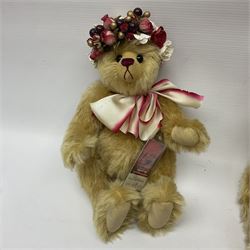 The Cotswold Bear Company - two teddy bears from ‘The Flower Collection’ comprising ‘Mayflower’ no.99/100, blonde mohair with dark pink flower crown and bow, H33cm; ‘Phoenix’ no. 99/100, blonde mohair with white and red rose flower crown and bow, H28cm; both with original labels and purchase receipt (2)