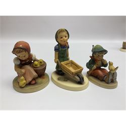 Twenty eight Hummel figures by Goebel, to include Mountaineer, Private Conversation, Kitty Kisses, Little Goat Herder etc  