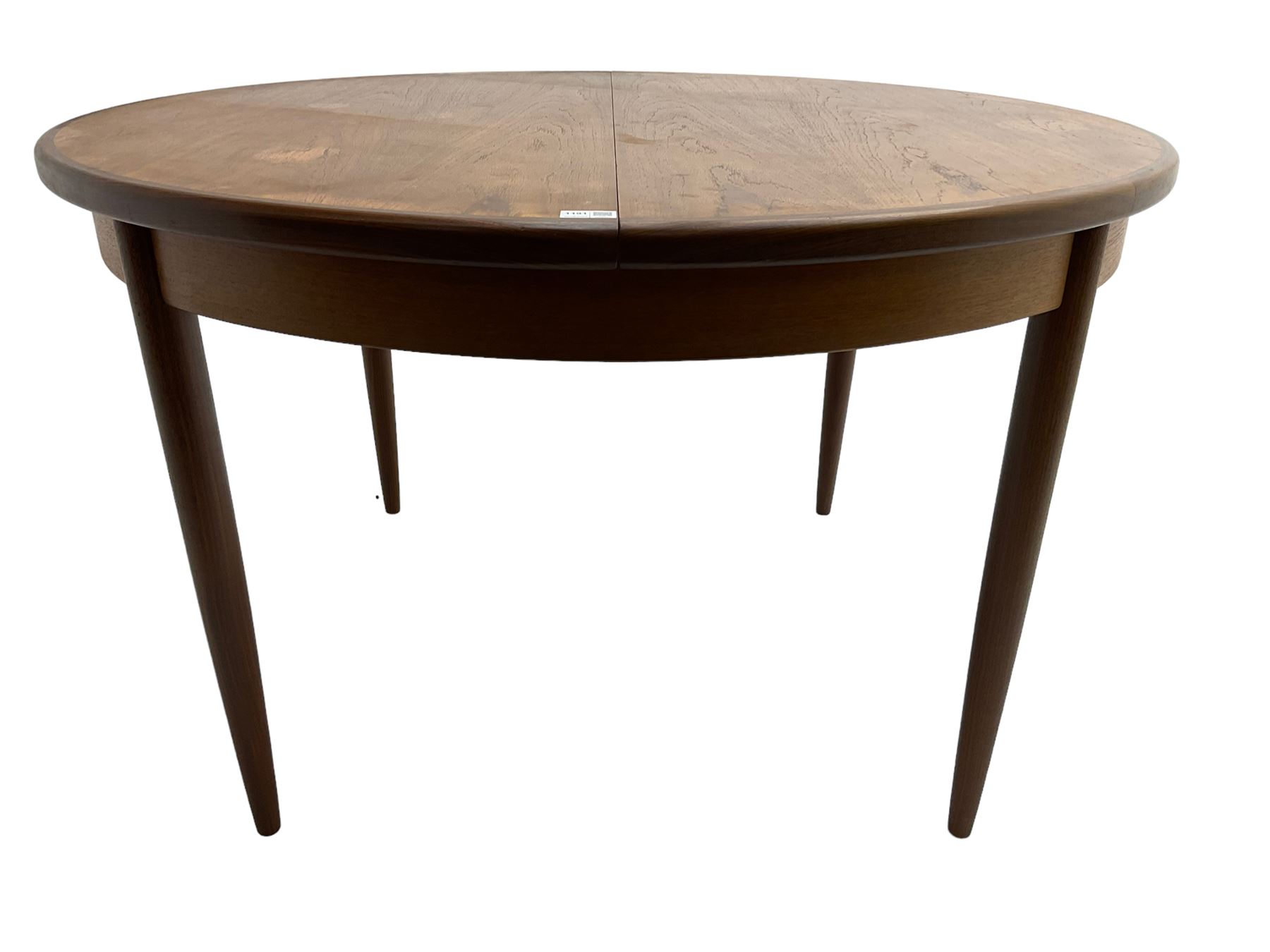 G-Plan - mid-20th century teak 'Fresco' extending dining table, circular top on tapered supports (W122cm H74cm); and Leslie Dandy for G-Plan - set six mid-20th century teak 'Fresco' dining chairs, high backs over tan leatherette seats (W46cm H91cm)