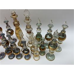 Bohemian glass perfume bottles, with etched and gilt decoration and stoppers modelled as twisted flames, tallest H20cm (22)