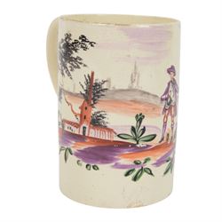 18th century Leeds creamware mug, circa 1770, of cylindrical form with curved strap handle, painted in purple, red and green with a peasant toasting with a glass of ale within a bucolic setting, H12.5cm