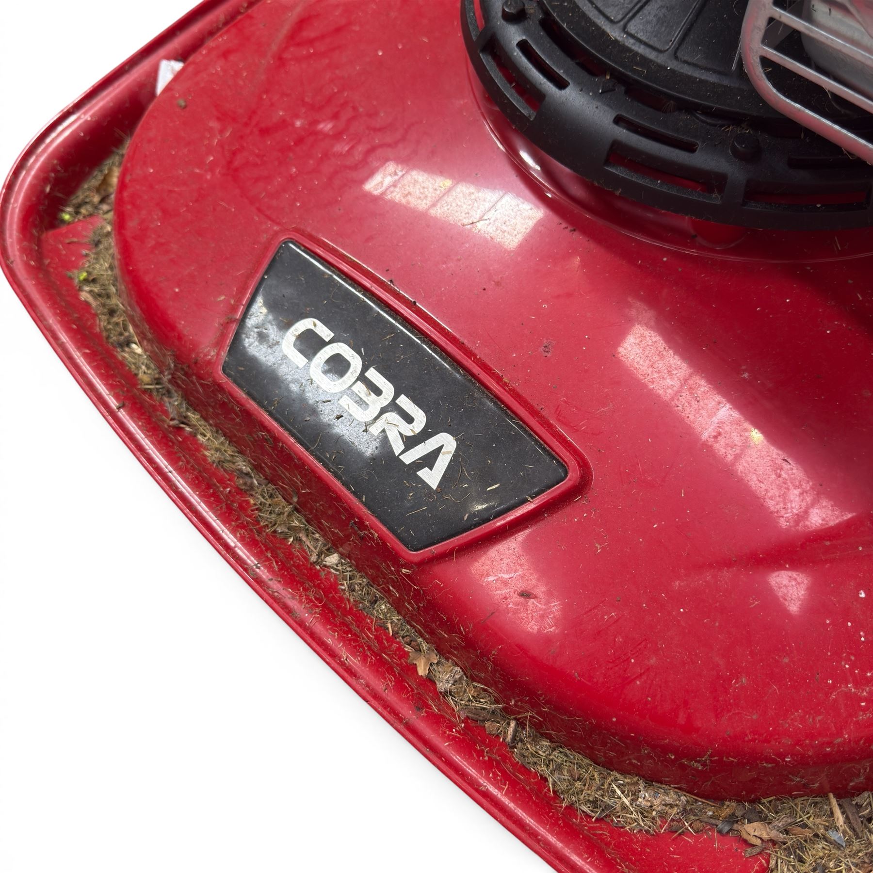Cobra-  575ex petrol hover mower, with Briggs & Stratton engine, wheeled transport frame and red deck.