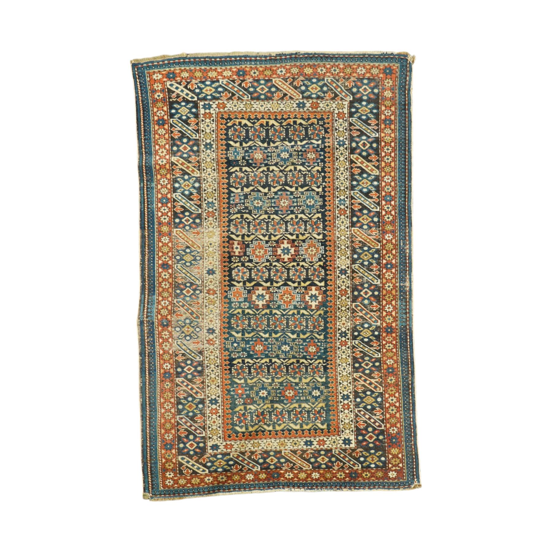 Two antique Caucasian Shirvan rugs, indigo field decorated with horizontal bands of small geometric floral and star motifs within multiple finely drawn borders featuring diamonds, rosettes, and stylized leaves in a palette of madder red, ivory, ochre, and pale blue, with fringe ends, 195x137cm, together with a similar smaller rug, 143x96cm