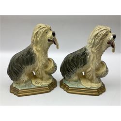 Pair of cast iron Dulux Old English sheepdog doorstops together with another modelled as a golfer