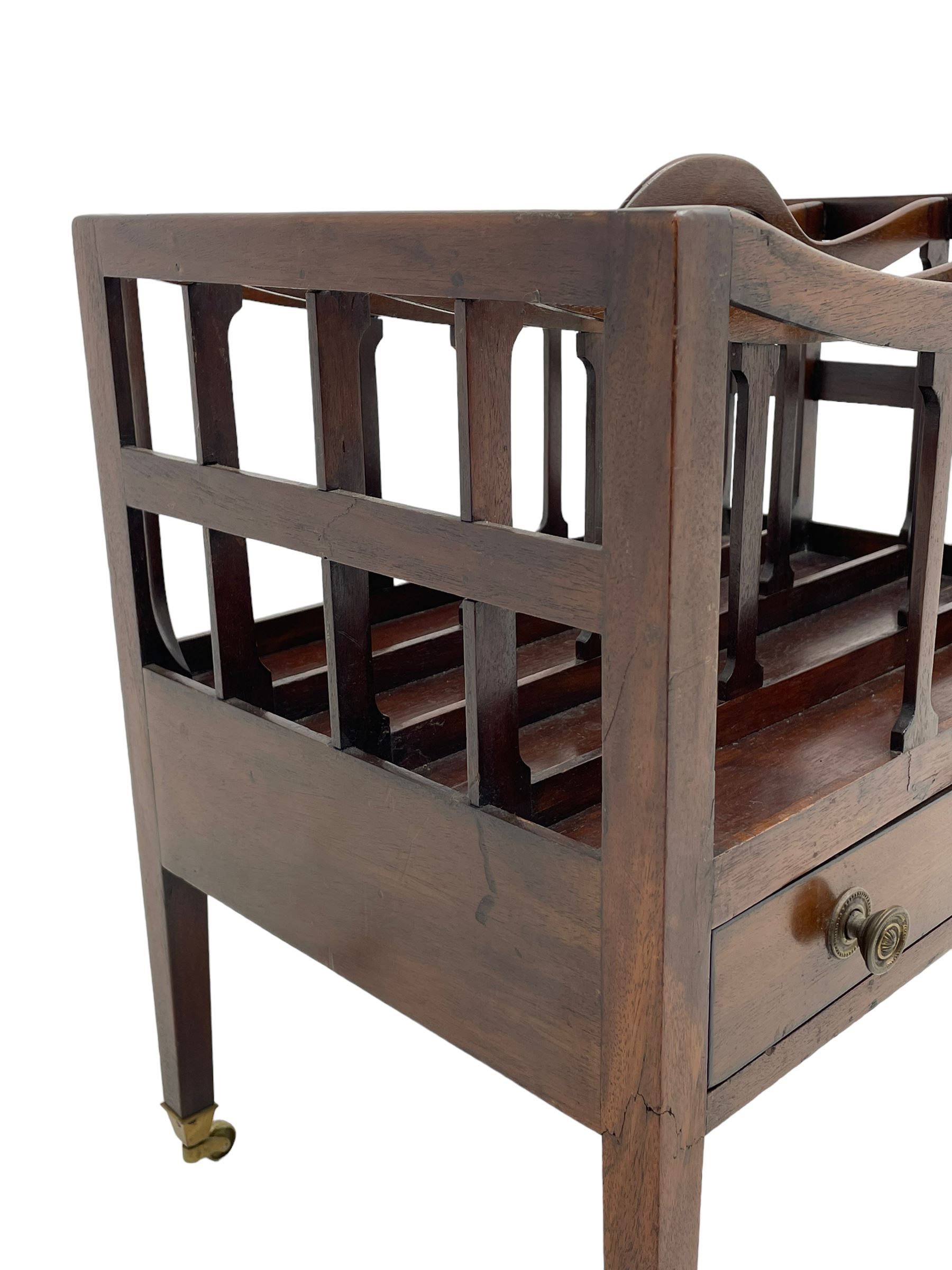 Georgian design mahogany Canterbury, four divisions with dished upper rails, the central rail pierced with handle, fitted with single drawer, on square supports with brass cups and castors 