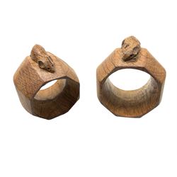 Mouseman - pair of oak napkin rings, of bulbous octagonal form each carved with mouse signature, by the workshop of Robert Thompson, Kilburn, L4.5cm W6cm