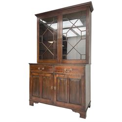 Acorn Industries - Georgian design mahogany bookcase on cupboard, fitted with two astragal glazed doors enclosing three glass shelves, base with two cock-beaded drawers over two panelled cupboards, inlaid with acorn signature, by Alan Grainger, Brandsby