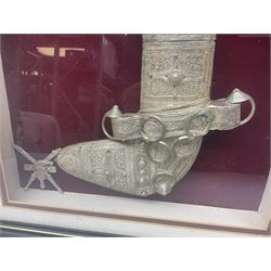 20th century silver Khanjar dagger from Oman, heavily decorated with filigree throughout, dome shaped pommel and waisted grip, the sheath with fastening rings, with miniature curved dagger accessory, housed in red lined glazed box frame, L38cm