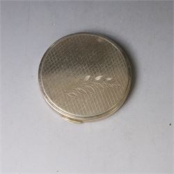 1960s silver compact mirror, of circular form with engine turned and engraved foliate decoration to lid, hallmarked Kigu Ltd, London 1963 and an early 20th century silver cigarette case with engraved monogram to cover, hallmarked A J Pepper & Co, Birmingham 1918